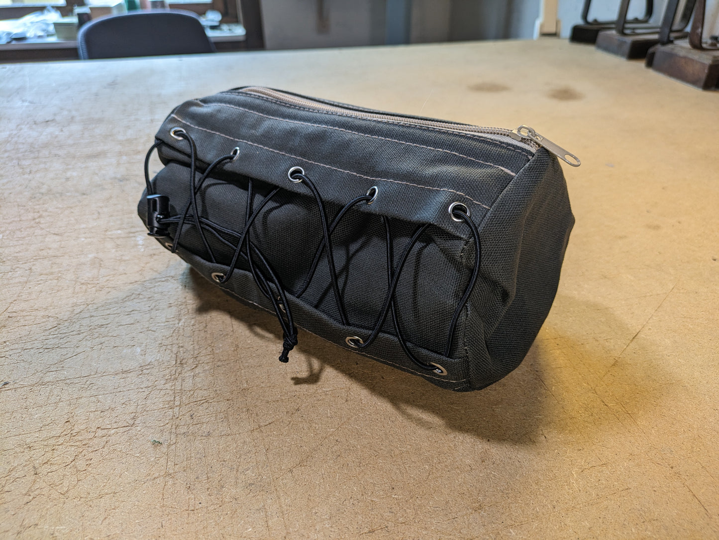 Army green handlebar bag with beige webbing