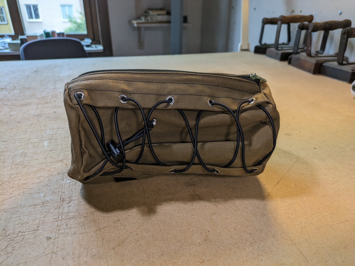 Drab/Khaki handlebar bag with black webbing and flexcord